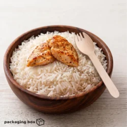 Birchwood dinner spork placed in a wooden bowl of rice and grilled chicken — eco-friendly wooden cutlery by PackagingBox.pk