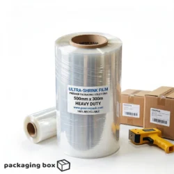 Person wrapping a cardboard box with heavy duty clear cling film roll 500mm x 300m for secure food and product packaging in Pakistan