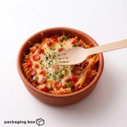 Eco-friendly wooden fork placed in a cheesy baked pasta bowl with vegetables — sustainable disposable cutlery by PackagingBox.pk