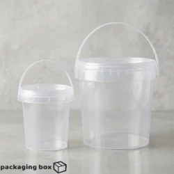 Clear transparent disposable food packaging buckets with snap lid and carry handle in twClear transparent disposable food packaging buckets with snap lid and carry handle in two sizes — food-grade plastic packaging in Pakistan.o sizes — food-grade plastic packaging in Pakistan.