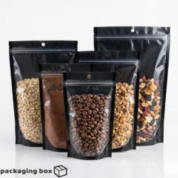 Front transparent back black aluminium standup pouch filled with coffee beans grains and dry fruits