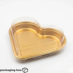 Heart shape chocolate boxes with transparent lid and gold base in multiple sizes filled with premium chocolates — available in Pakistan
