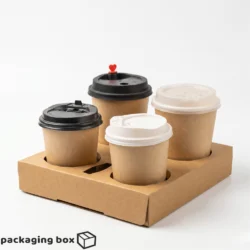 Kraft cardboard 4-cup coffee carrier holding four paper cups with different lids – black, white and red heart lid – eco-friendly drink tray by Packaging Box Pakistan
