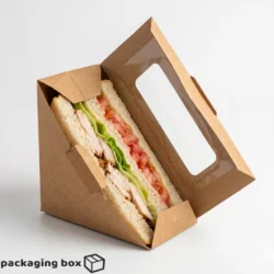 Kraft brown triangle sandwich box with clear window for cafes, bakeries and food delivery packaging in Pakistan.