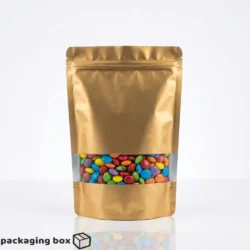 Matt Golden Standing Pouches with Window in 4 sizes filled with colourful candies by Packaging Box Pakistan