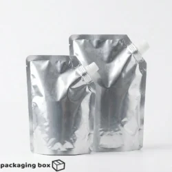 Plain Aluminum Standup Spout Pouches in two sizes with white screw cap spout by Packaging Box Pakistan