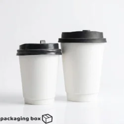 Two 8oz and 12oz white double wall paper coffee cups with black plastic lids on white background by Packaging Box