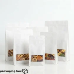 White flat bottom side gusseted pouch with window filled with nuts and dry fruits