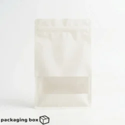 White flat bottom side gusseted pouch with window filled with nuts and dry fruits