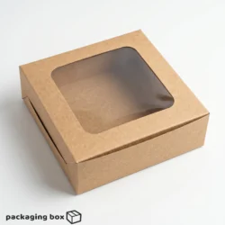Kraft brown 4-piece brownie box with large square clear window showing 4 fudgy pecan chocolate chip brownies inside