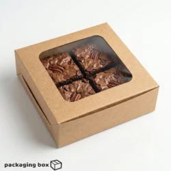 Kraft brown 4-piece brownie box with large square clear window showing 4 fudgy pecan chocolate chip brownies inside