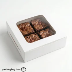 White 4-piece brownie box with large square clear window showing 4 fudgy pecan chocolate chip brownies inside