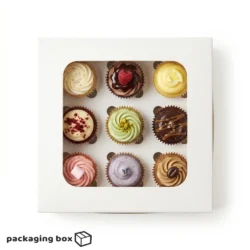 White 9 cupcake box with square clear window holding assorted decorated mini cupcakes
