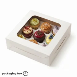 White 9 cupcake box with square clear window holding assorted decorated mini cupcakes