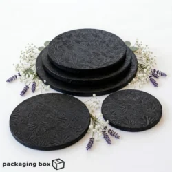 Black Cake Drum Board supporting a 2-tier white fondant wedding cake with blush roses and eucalyptus