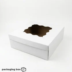 White extra large deep cake box with decorative wavy transparent PVC window on lid β side angled view showing wide footprint and deep sidewalls on white background β PackagingBox.pk