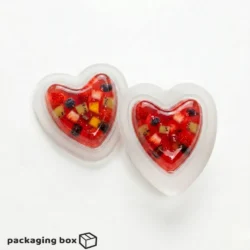 Two Heart Jelly Cups filled with vibrant mixed fruit jelly including strawberry, mango, kiwi and blueberry — by PackagingBox.pk