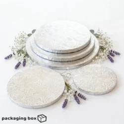 Silver Cake Drum Board supporting a 2-tier white fondant wedding cake with blush roses and eucalyptus